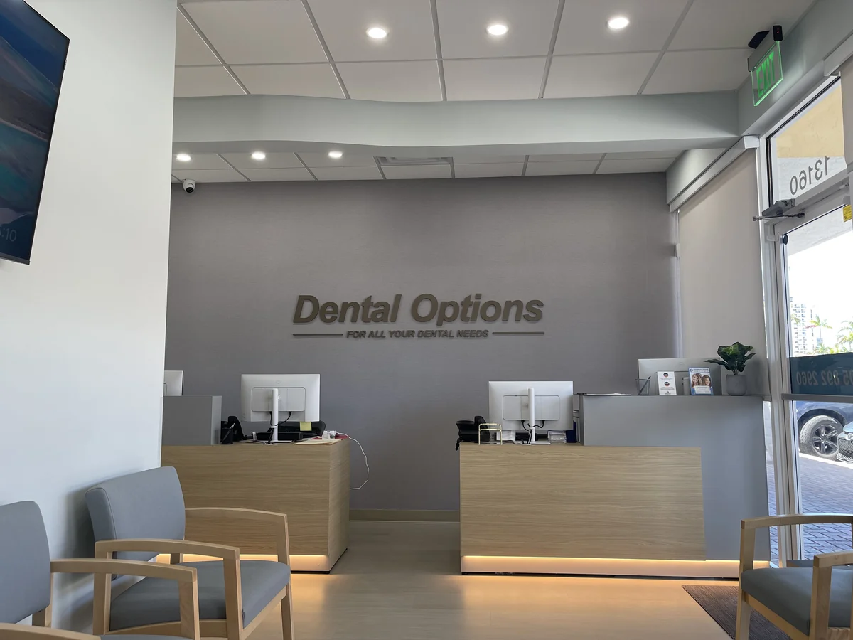 Reception desk and waiting area at the Dental Options North Miami office
